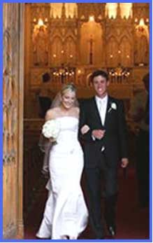 Bride and groom leaving Loretto Chapel